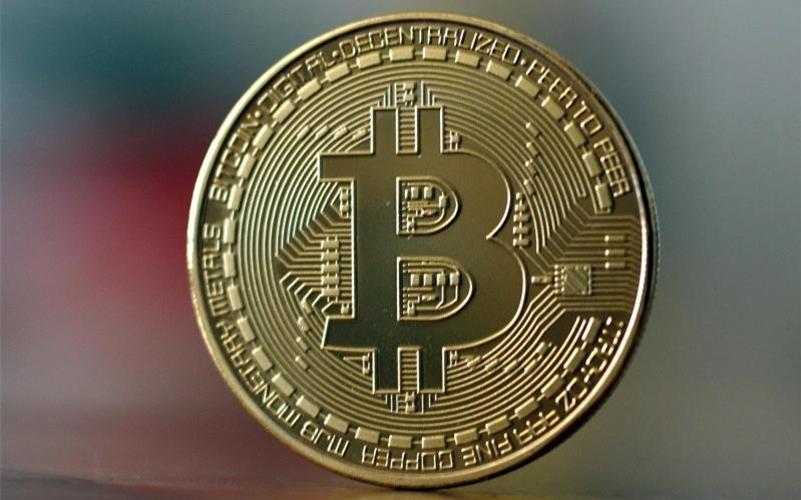 Die älteste und nach Marktwert größte Digitalwährung: Bitcoin. Foto: Ina Fassbender/dpa